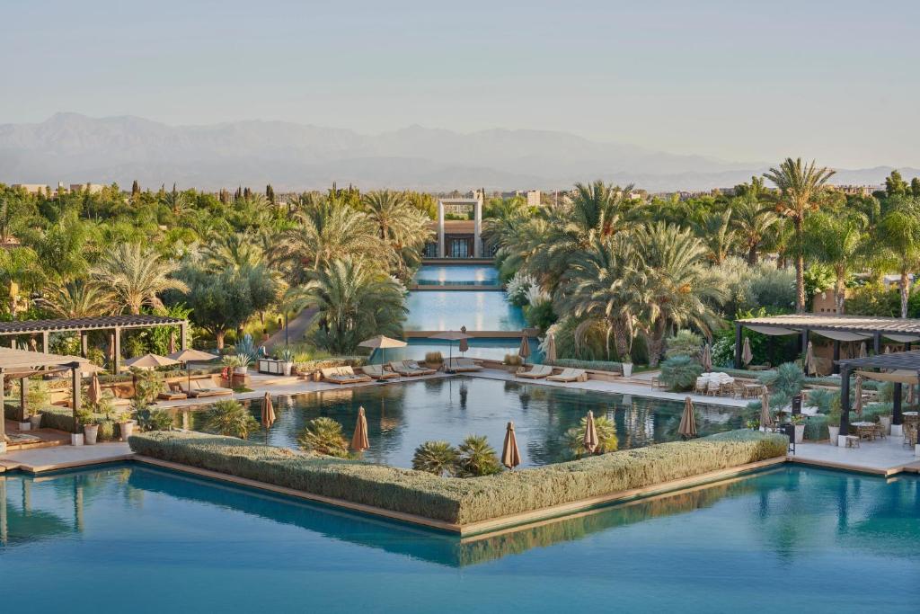 Mandarin Oriental Marrakech luxury resort surrounded by lush gardens and Atlas Mountains in Morocco