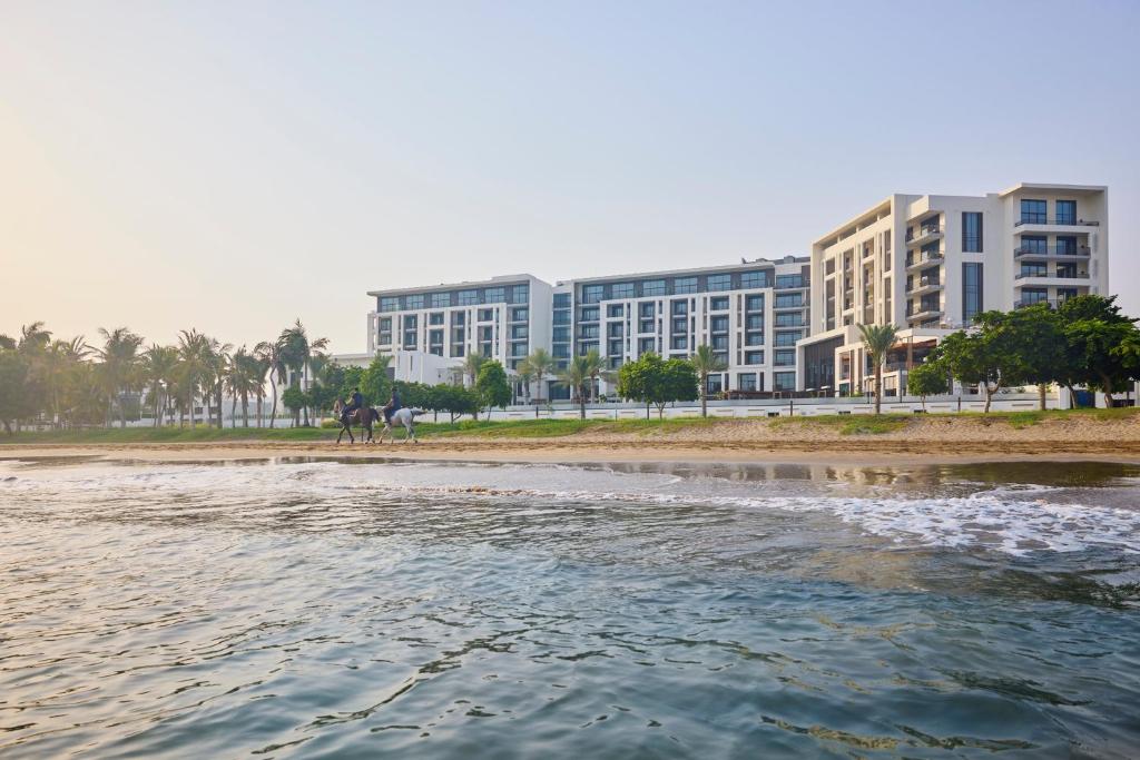 Mandarin Oriental Muscat overlooking the Arabian Sea with elegant beachfront architecture in Oman