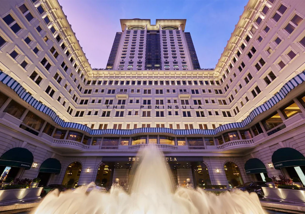 The Peninsula Hong Kong overlooking Victoria Harbour, showcasing its iconic colonial architecture and timeless luxury.