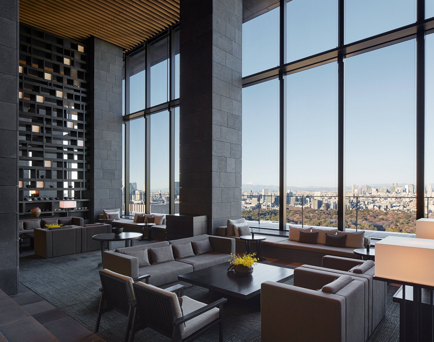 Aman Tokyo hotel interior showcasing minimalist Japanese design, floor-to-ceiling windows, and serene city views in the heart of Tokyo, Japan