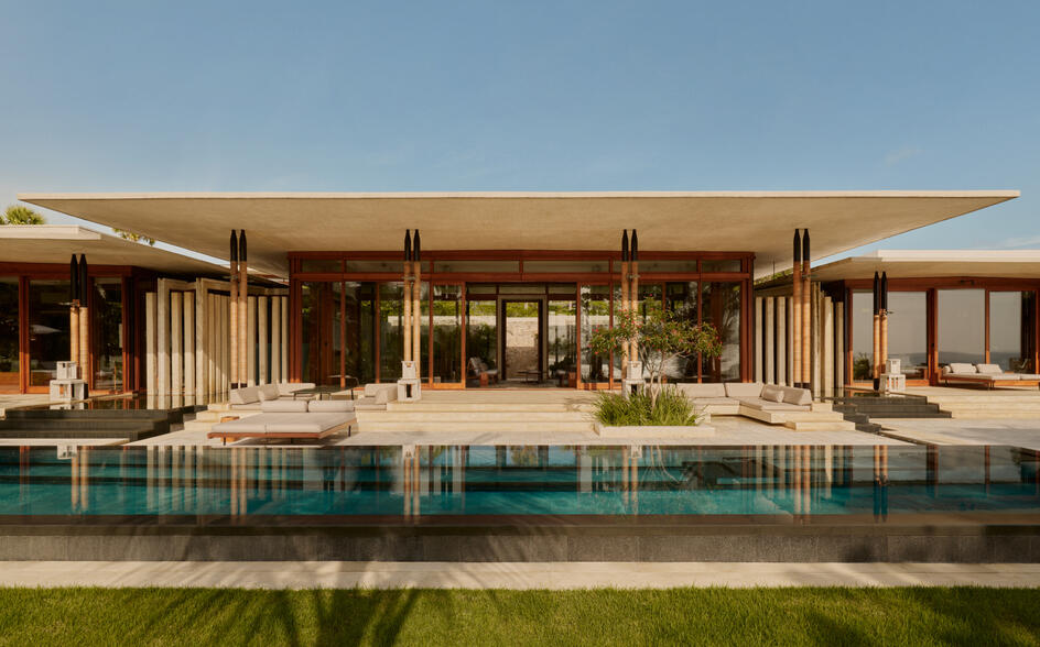 Amanera resort perched on a dramatic clifftop overlooking the turquoise Caribbean Sea in the Dominican Republic, surrounded by lush tropical greenery and untouched coastline