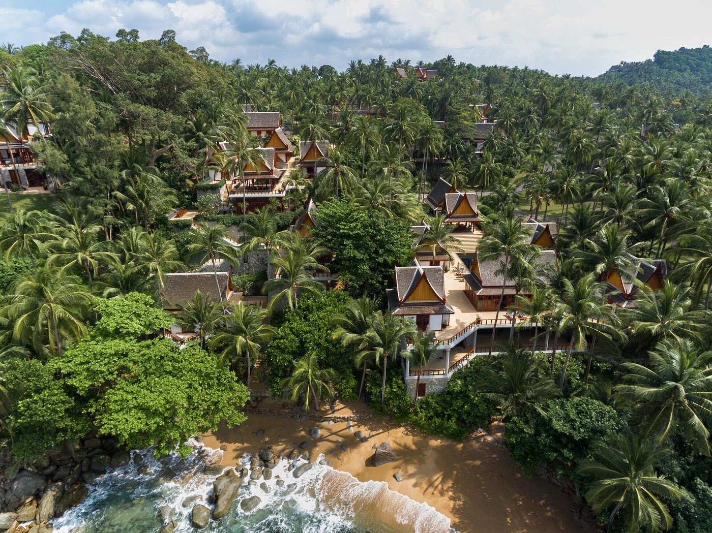 Amanpuri Phuket resort overlooking the Andaman Sea with elegant pavilions, coconut palms, and a serene private beach in Thailand