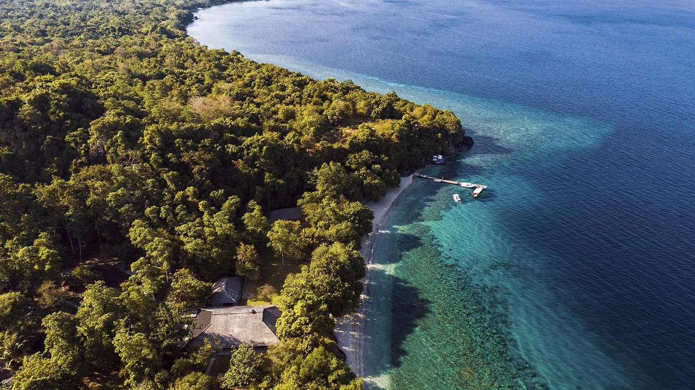 Amanwana Moyo Island luxury tented camp nestled in the pristine wilderness of Moyo Island, Indonesia, surrounded by lush forest and turquoise waters